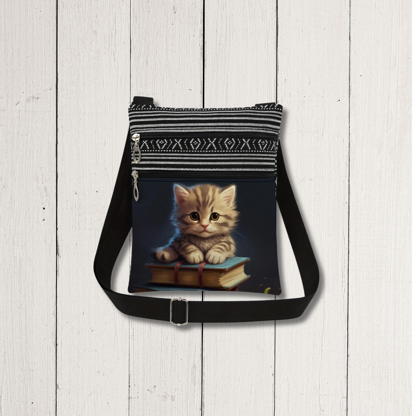 Cute cartoon cat sitting on an open book, illustrated on a canvas bag, with a playful and relaxed expression.