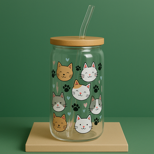 glass tumbler with bamboo lid and glass straw.  Illustrations of cat faces and paw prints.