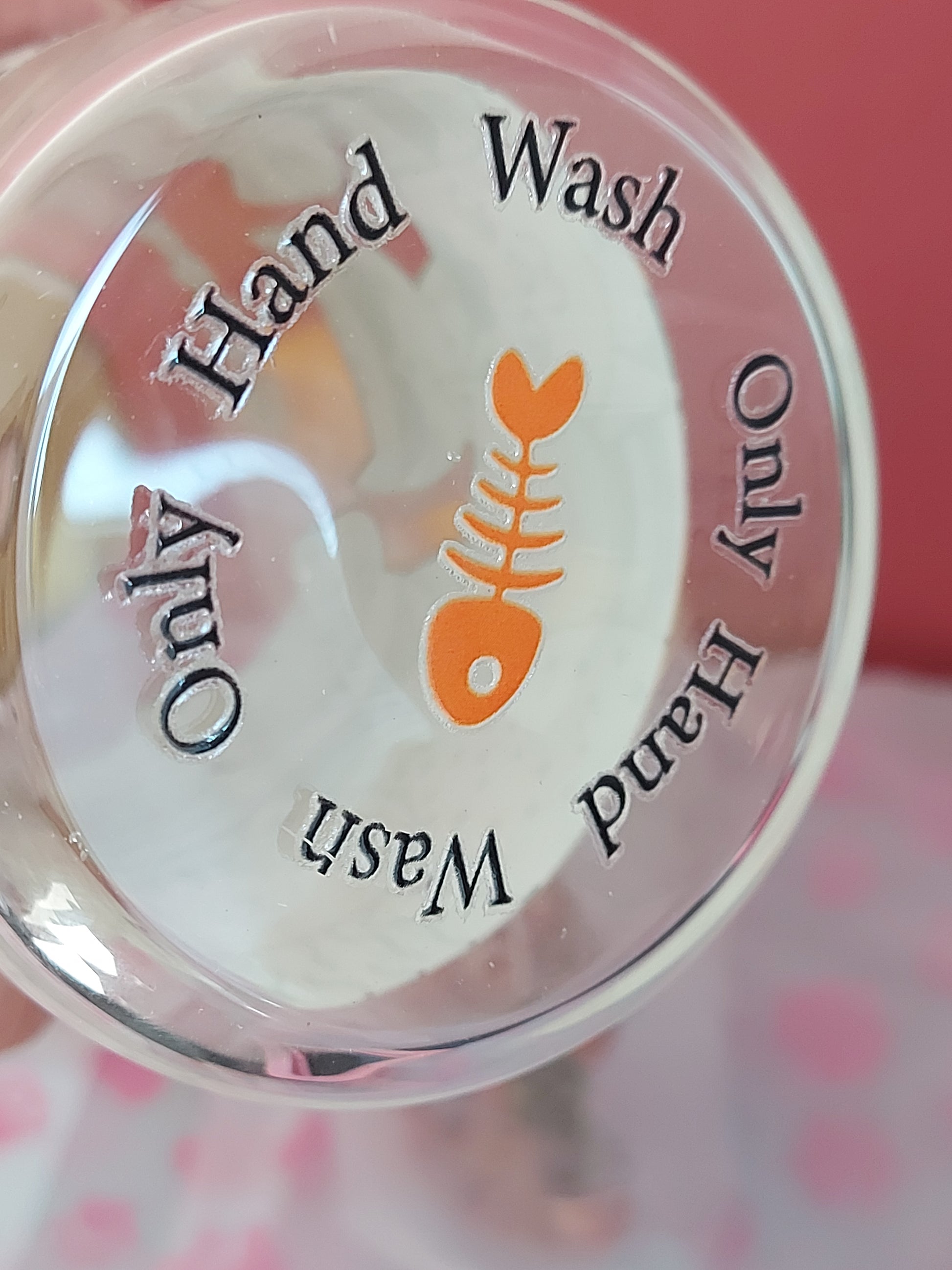 Bottom view of glass cup highlighting hand wash only instructions – ideal cat gift