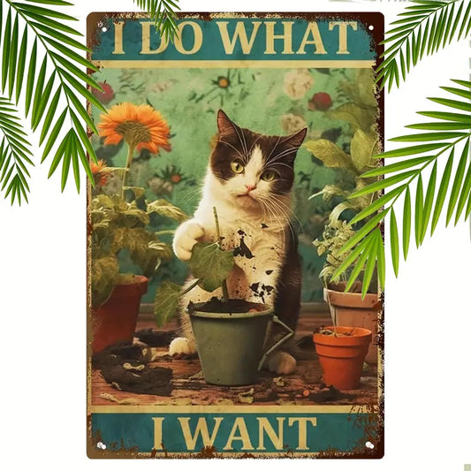 Vintage-style metal wall art featuring a mischievous cat digging in a plant pot with the quote 'I Do What I Want.' Retro cat décor, perfect for cat lovers.