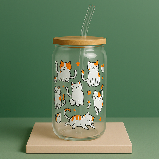 glass tumbler with bamboo lid and glass straw.  Illustrations of cats and flowers on it